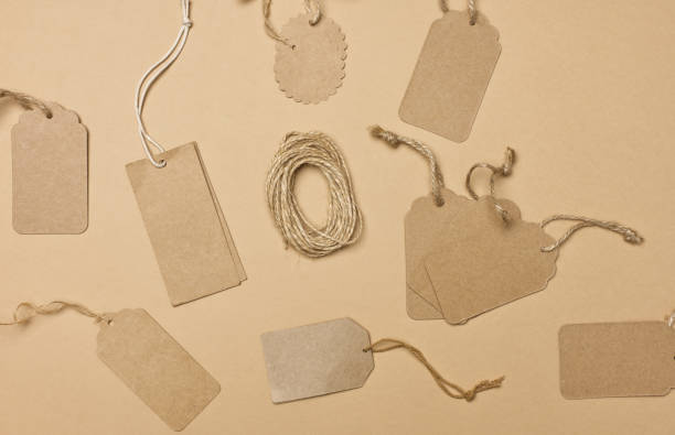 istock blank brown rectangular, round brown paper tag on a rope isolated on white background, template for price, discount 1346148315
