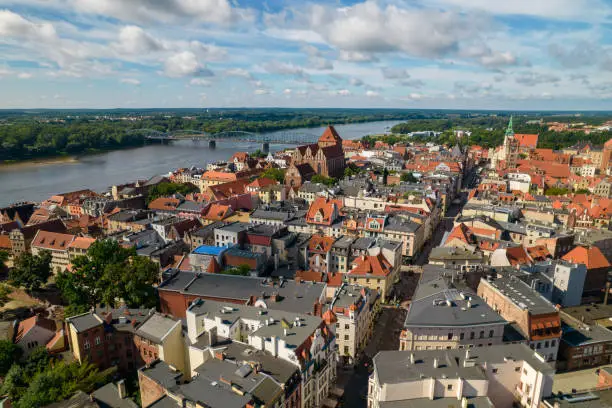 Torun, a Polish city during the day. A sunny and slightly cloudy day in Toruń on the Vistula River.