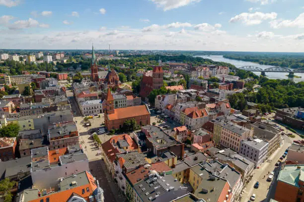 Torun, a Polish city during the day. A sunny and slightly cloudy day in Toruń on the Vistula River.