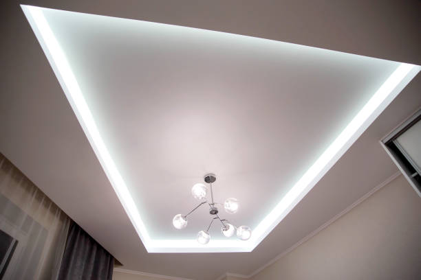 istock A beautiful stretch ceiling with diode lighting and an unusual chandelier with balls. Designer modern ceiling 1346152903