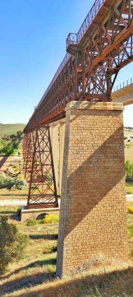 istock Iron bridge of the Hacho by Gustave Eiffel in Alamedilla - Granada 1346153121