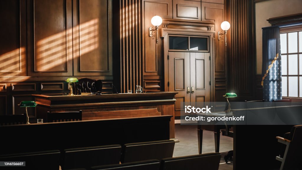 Empty American Style Courtroom. Supreme Court of Law and Justice Trial Stand. Courthouse Before Civil Case Hearing Starts. Grand Wooden Interior with Judge's Bench, Defendant's and Plaintiff's Tables. Courtroom Stock Photo