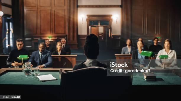 Court Of Law Trial Female Judge And And Jury Sit Start Of A Civil Case Hearing Proceedings In Motion To Rule Out A Sentence Defendant Is Not Convicted Nor Not Guilty Stock Photo - Download Image Now