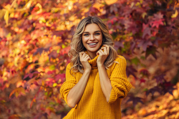 istock Beautiful woman enjoying autumn 1346156755