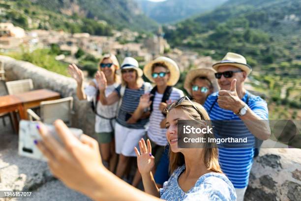 Multi Generation Family Sightseeing Beautiful Town Of Valldemossa Majorca Spain Stock Photo - Download Image Now
