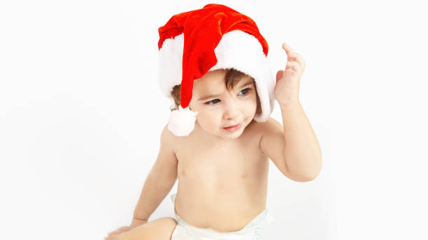 istock Christmas toddler in Santa hat 1346158639