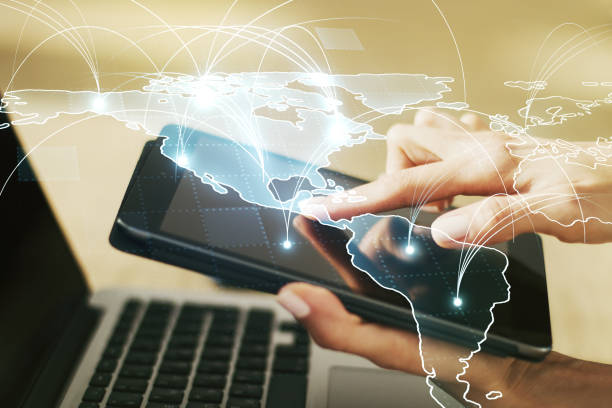 istock Double exposure of abstract digital world map with connections and hand working with a digital tablet on background, big data and blockchain concept 1346161828