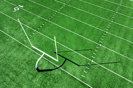 3d rendering american football field with goalpost in stadium