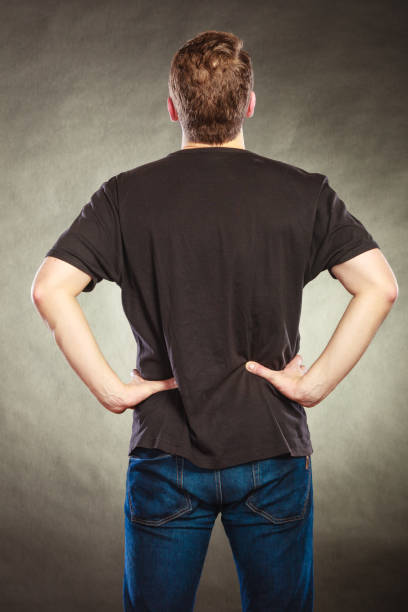 istock Back view man guy in blank shirt with copy space. 1346162052