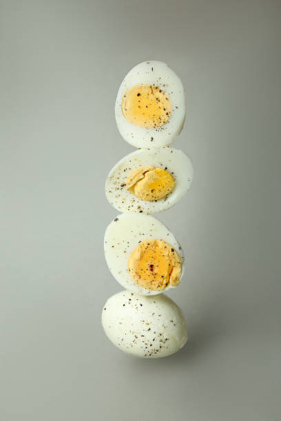 istock Tasty boiled eggs with spices on gray background 1346163503
