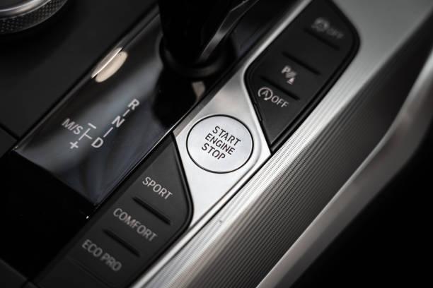 кнопка старт-стоп двигателя современного роскошного спорткара. - mode of transportation стоковые фото и изображения