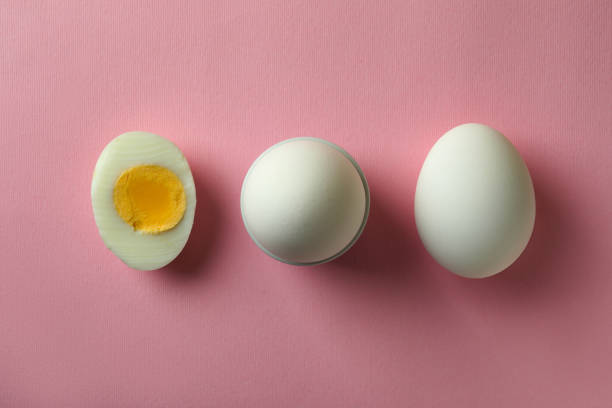 istock Tasty boiled eggs on pink background, top view 1346163763