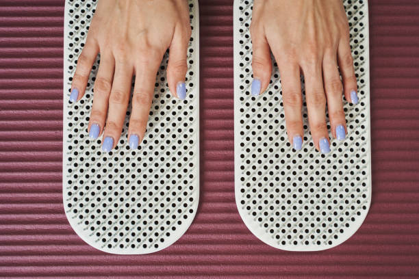 istock female palms on needles on the rug. yoga practice. 1346163912