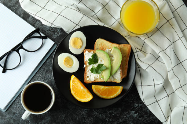 Concept of tasty breakfast with boiled eggs, top view
