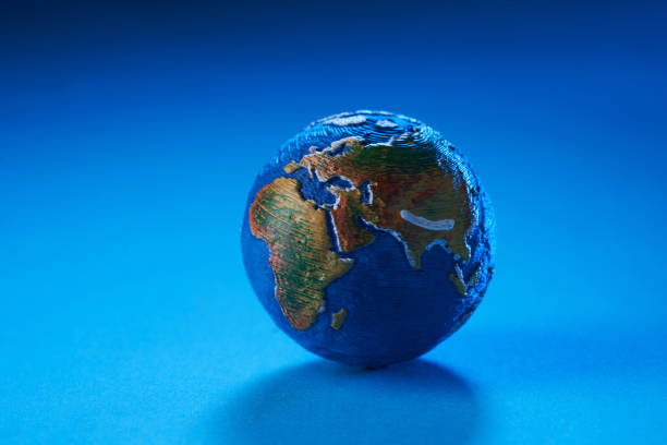 istock mini globe showing asia on blue background 1346164245