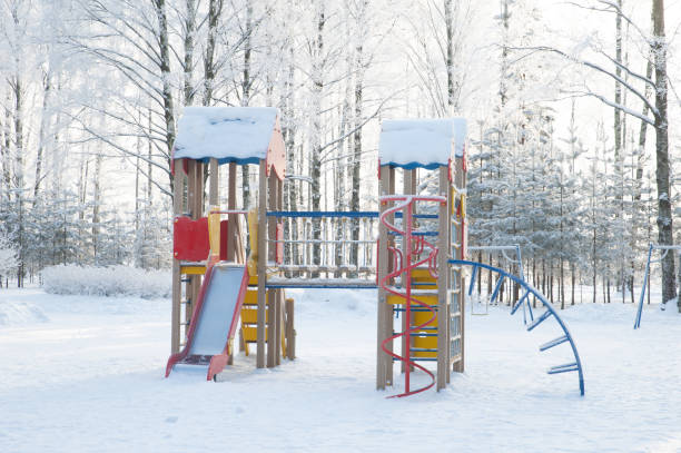 istock Empty children's playground in the winter park 1346166392
