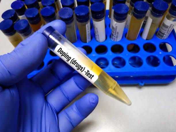 Doping (drugs) test of urine specimen. Laboratory sample of urine for doping drugs test. Doping is used of banned athletic performance enhancing drugs by athlete in competitive sports. Medical test in sports medicine concept. anti doping stock pictures, royalty-free photos & images