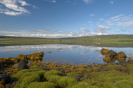 View looking across Loch Greshornish from the beach near Edinbane on the Isle of Skye in Scotland.