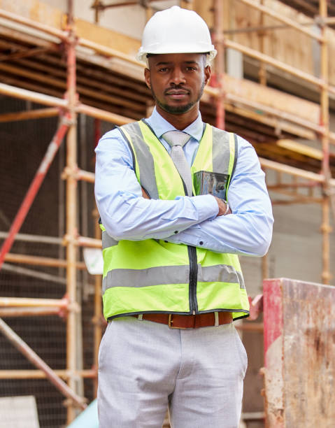 Shot of a young man working on a construction site outside