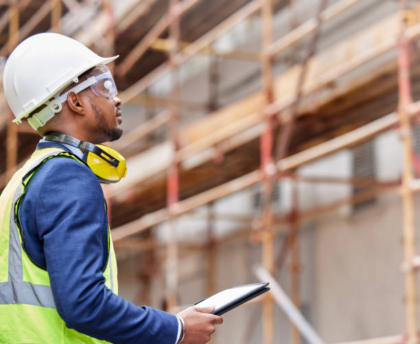 istock Shot of a young man working on a construction site outside 1346171126