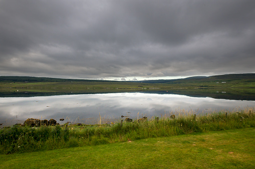 View looking across Loch Greshornish from the beach near Edinbane on the Isle of Skye in Scotland.