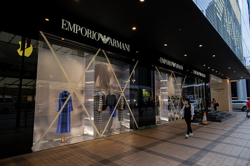 Hong Kong - October 12, 2021 :  Windows of the Emporio Armani are taped in preparation for typhoon Kompasu on October 12, 2021 in in Tsim Sha Tsui, Kowloon, Hong Kong.