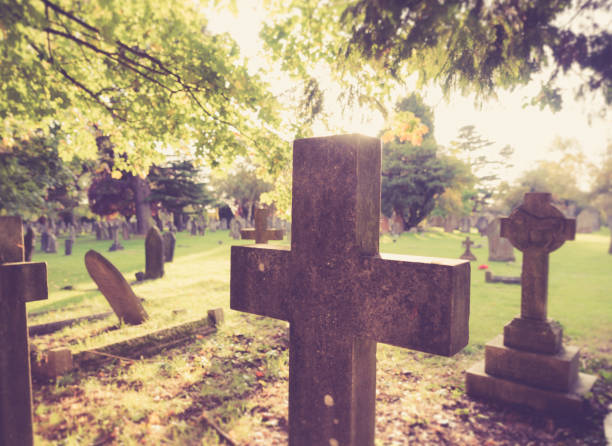 istock Religious cross at the cemetery. 1346173942