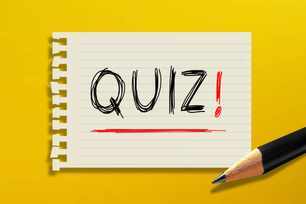 istock Quiz time concept, white paper with pencil on yellow background 1346176056
