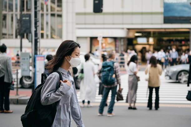 istock Commuting woman and pedestrian on street 1346176874