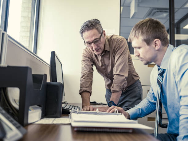 istock Two men at the office meeting 1346177338