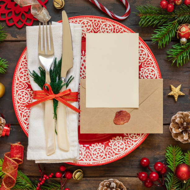 istock Festive table setting with Christmas decorations. Card and envelope mockup 1346178188