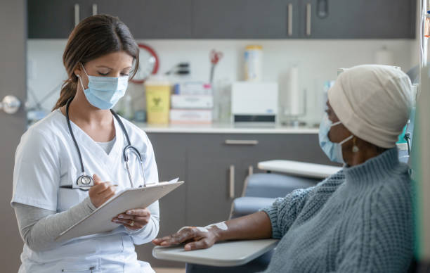 istock Talking Over Cancer Treatment Symptoms 1346178235