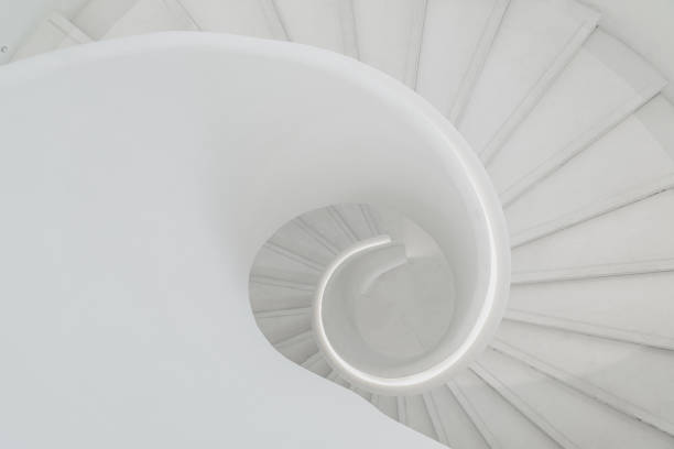 istock spiral grey white staircase with large copy space 1346178747
