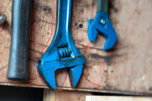 istock Adjustable wrench spanner on a wooden board - Service hand tool equipment. 1346179830