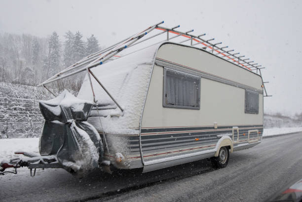 istock car with a trailer in winter 1346182511
