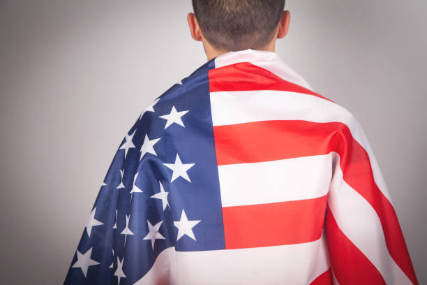 istock Caucasian man with a American flag. 1346185767