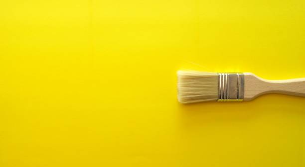 istock Yellow bright banner with artistic wooden brush 1346185980