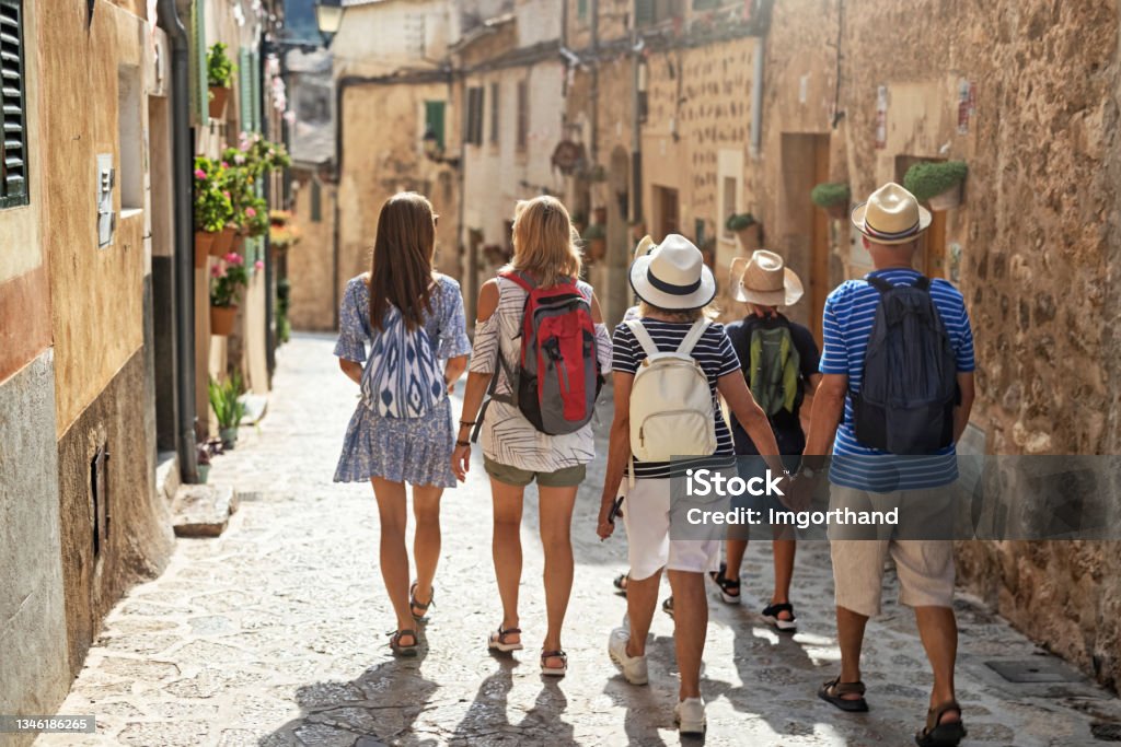Multi generation family sightseeing beautiful town of Valldemossa, Majorca, Spain Multi generation family sightseeing beautiful town of Valldemossa. Sunny summer day in Majorca, Spain.
Mother, grandparents and teenagers are walking in sunny street.
Canon R5 Tourism Stock Photo