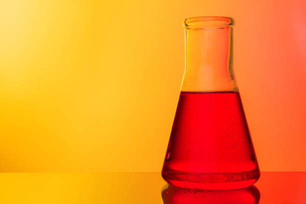 Science concept. Glass test tubes on red background