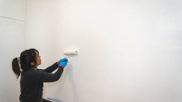 istock woman painting 1346188811