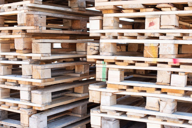 istock Pallet - wooden shipping container, grounds for collection, storage, transshipment and transportation of goods 1346188932