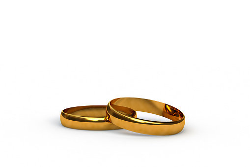 Render 3d de unos anillos de boda de oro, aislados sobre fondo blanco photo