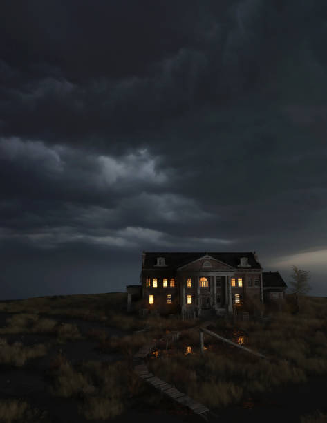 istock Ominous dilapidated and abandoned mansion on the prairie with illuminated interior lighting under a dark cloudy sky. 3D rendering. 1346190689