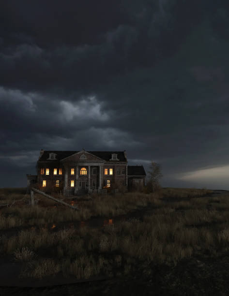 istock Ominous dilapidated and abandoned mansion on the prairie with illuminated interior lighting under a dark cloudy sky. 3D rendering. 1346190694
