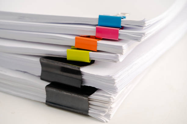 istock Stack of report paper files in business office clips 1346191019