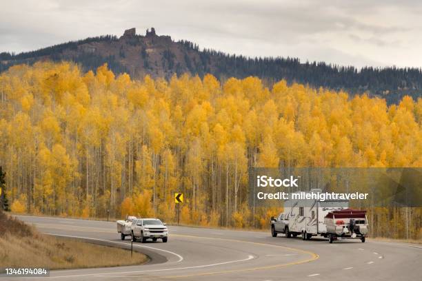 Vehicles Drive Highway Past Yellow Autumn Aspen Rabbit Ears Peak Pass Steamboat Colorado Stock Photo - Download Image Now