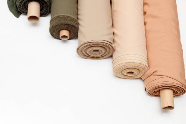 istock pastel color fabric rolls isolated on white, Synthetic and natural fabrics with copyspace. 1346195243