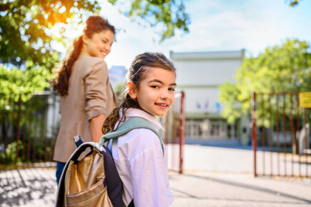 istock Mother taking her daughter to school 1346195618