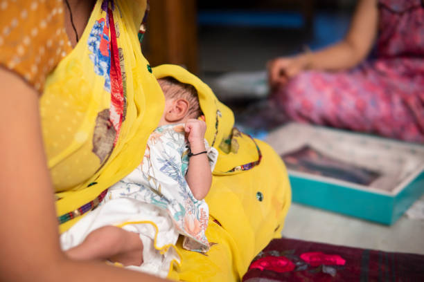 istock Indian mother breastfeeding her baby. 1346197478