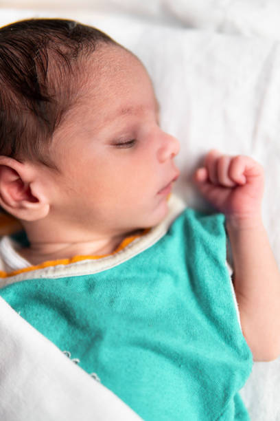 istock Cute peacefully newborn baby sleeping. 1346197888